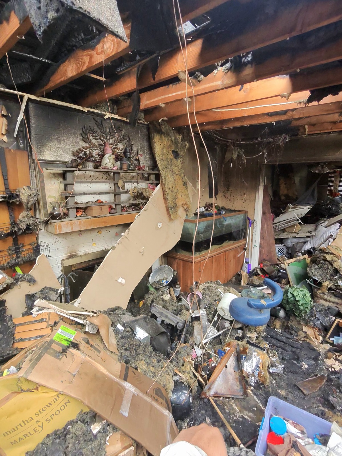 Fire and smoke damaged living room in a Denton, TX home before restoration