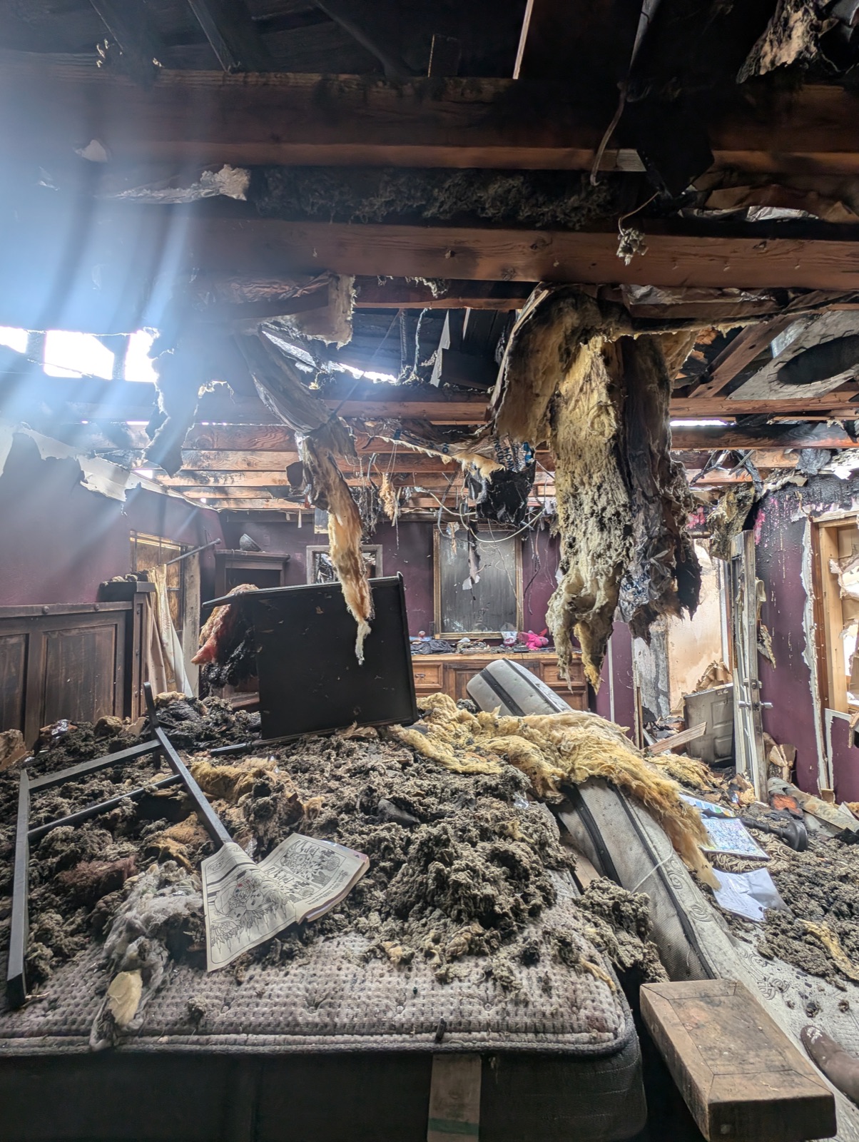 Fire damaged primary bedroom in a Denton, TX home before restoration