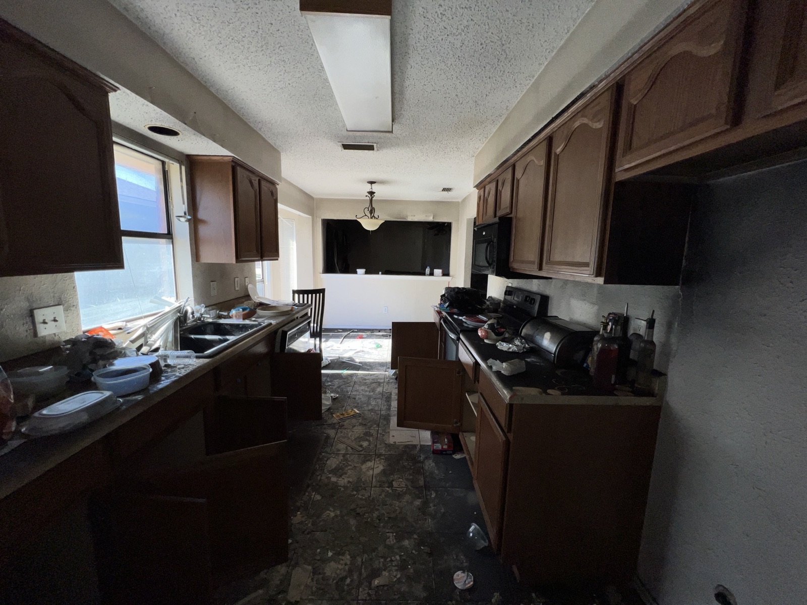 Smoke and fire damaged kitchen in a Plano, TX home before restoration