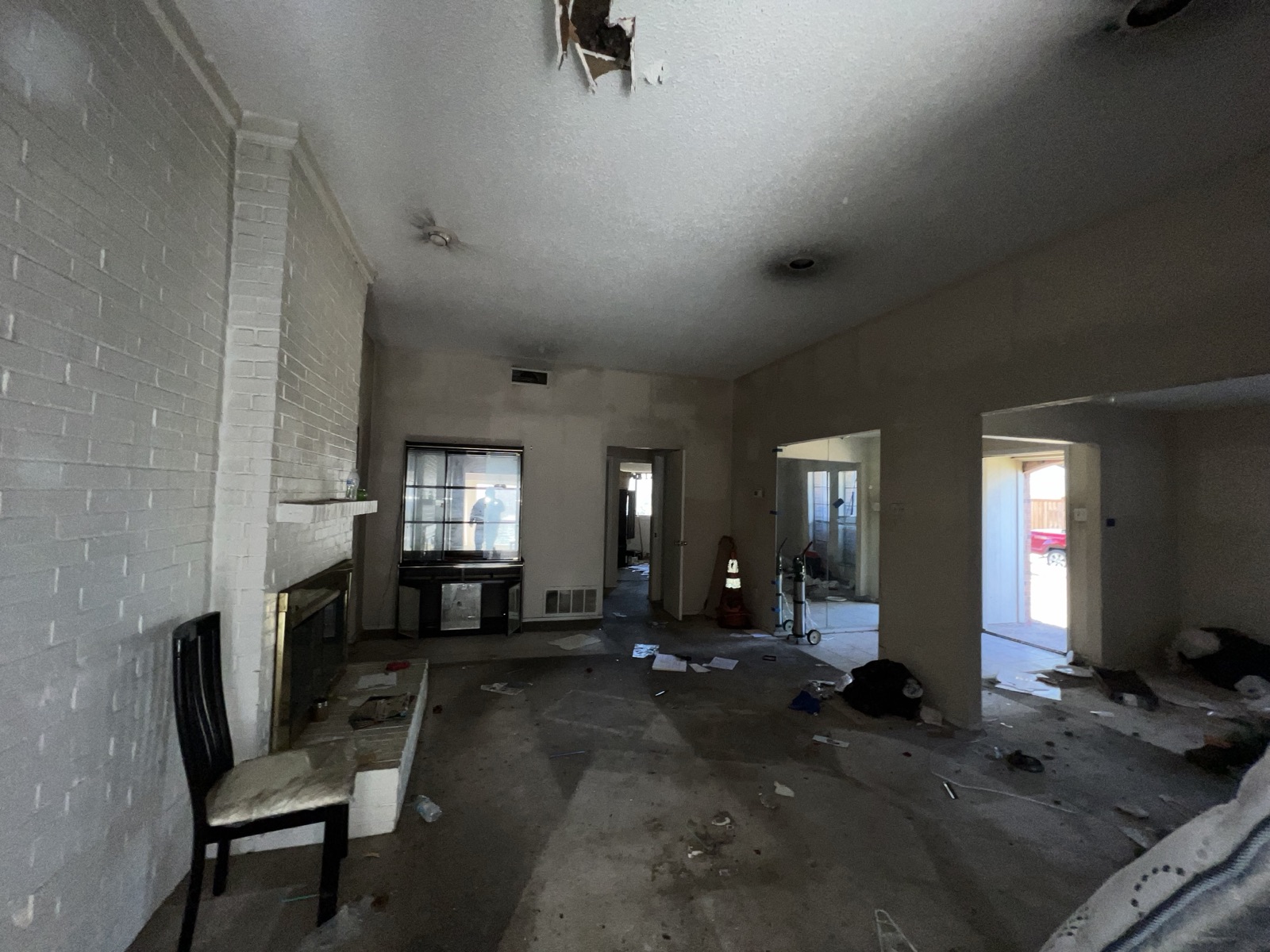 Fire and smoke damaged living room in a Plano, TX home before restoration