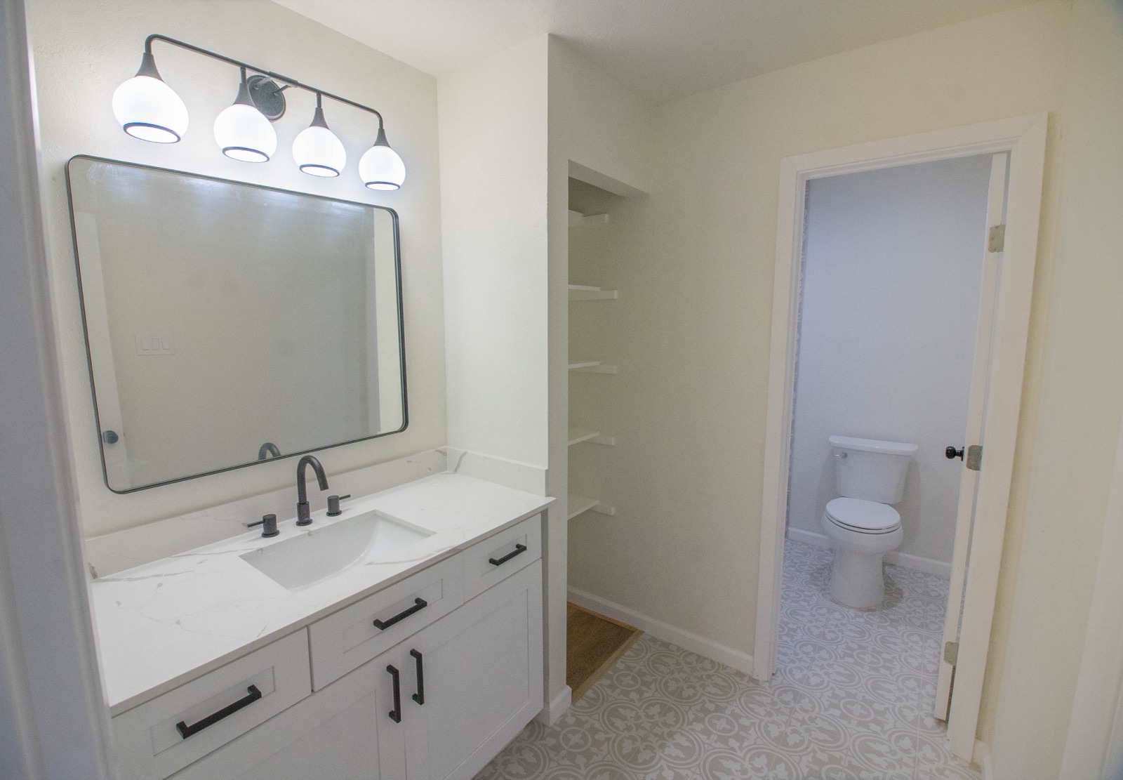 Restored secondary bathroom in a Plano, TX home after restoration